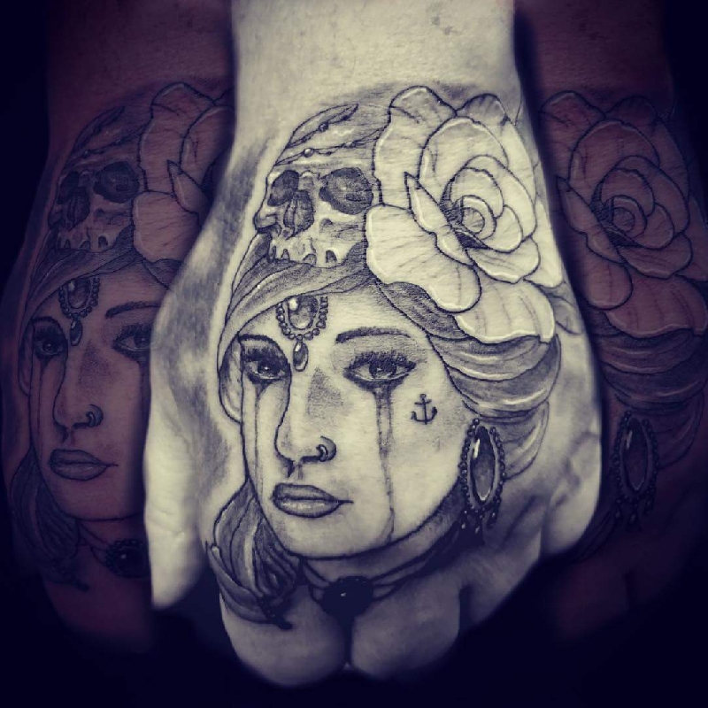 Women crying hand tat